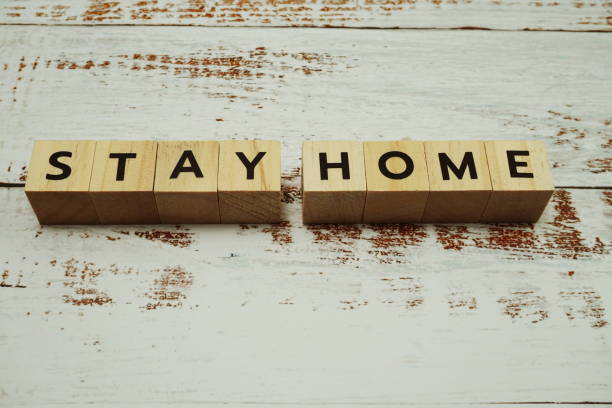 istock Stay Home alphabet letter on wooden background 1220487213