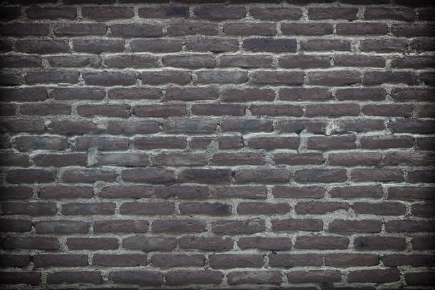 istock old dark brick wall cracked concrete vintage background 1220487914
