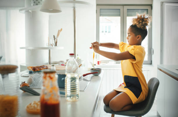 istock Little girl playing in the kitchen during quarantine 1220491774