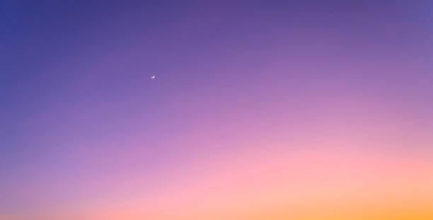 istock Beautiful twilight sky with crescent moon at dusk after sunset or before sunrise 1220492266