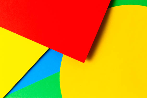 istock Abstract colored paper texture background. Minimal geometric shapes and lines in yellow, light blue, red, green colors 1220497115