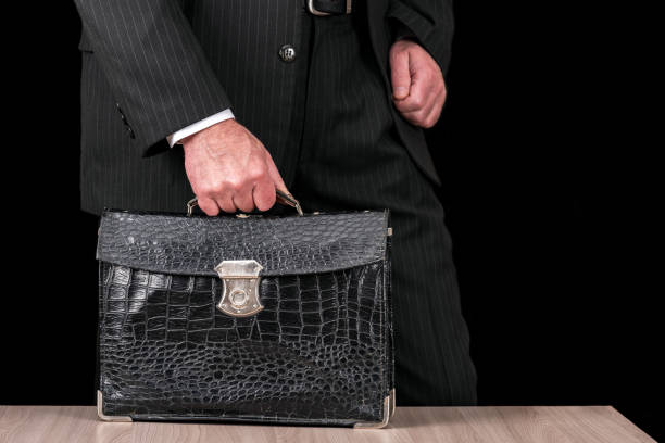 istock Vintage leather briefcase in a businessman hand 1220497417