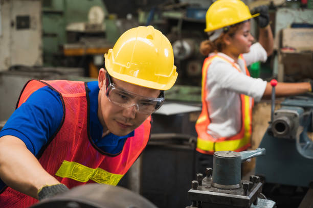 istock The industrial worker team is working on various projects in a large industrial factory with many equipment. 1220498139