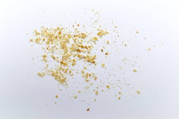 istock Scattered crumbs of cookies on white background. 1220498540