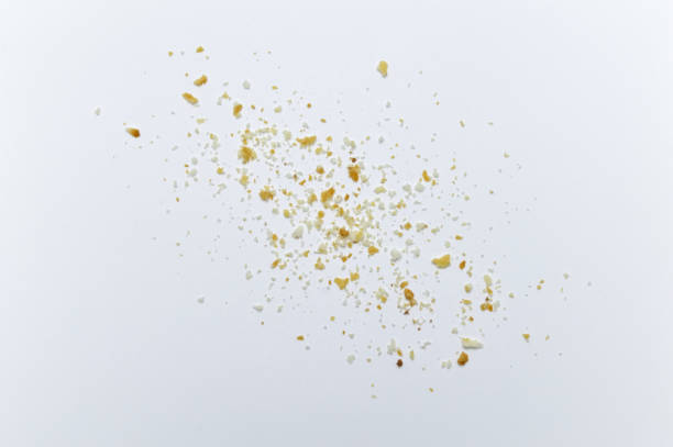 istock Scattered crumbs of cookies on white background. 1220498563