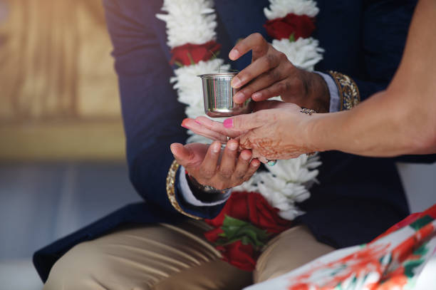 Indian Wedding Hindu Ceremony Indian Wedding Hindu Ceremony drinking from a ceremonial cup trophy wife stock pictures, royalty-free photos & images
