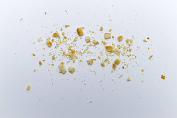 istock Scattered crumbs of cookies on white background. 1220498598