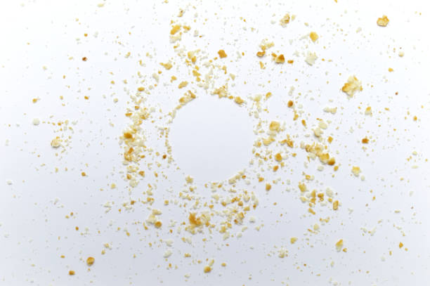 istock Scattered crumbs of cookies on white background. Copy space. 1220499102