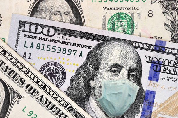 istock close up of dollar banknote with face mask 1220500620