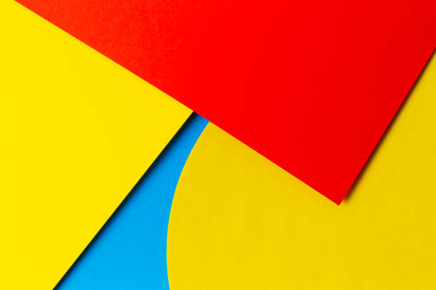 istock Abstract colored paper texture background. Minimal geometric shapes and lines in light blue, red and yellow colours 1220503089