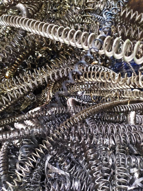 istock Closeup twisted spiral steel shavings with selective focus. metallurgy 1220504281