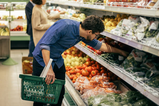 istock Focused people shopping in grocery store 1220506941