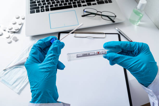 positive coronavirus test. saliva test for infection with the new sars-cov-2 virus - blood sample imagens e fotografias de stock