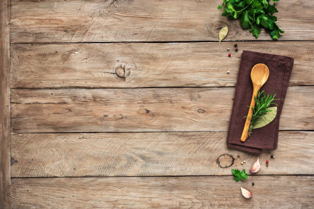 Cooking food background Herbs and spices with wooden spoon on wooden background. Cooking and healthy eating concept, top view, copy spce. table top shot stock pictures, royalty-free photos & images