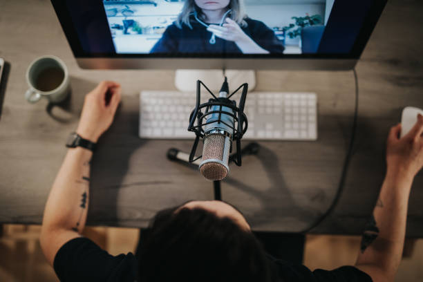 High angel view of a podcaster behind microphone