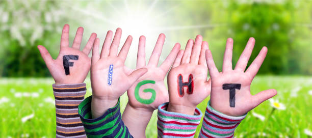 istock Children Hands Building Word Fight, Grass Meadow 1220513588
