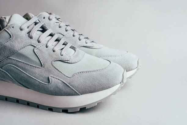 istock Gray sneakers on a gray background. 1220513662