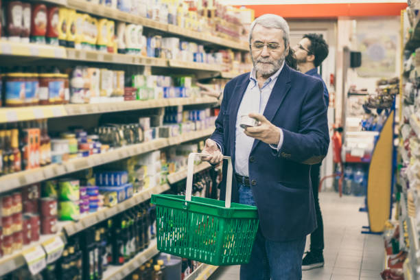 istock Mature man shopping in grocery store 1220513767