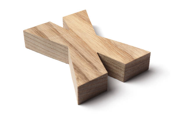 Tilted Letter X cut out from a piece of wood , isolated on white background.
