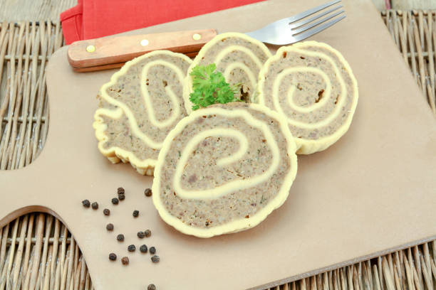 slices of fleischschnacka (Alsatian specialty) on a cutting board