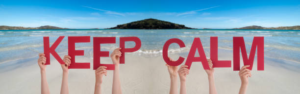istock People Hands Holding Word Keep Calm, Ocean Background 1220514826