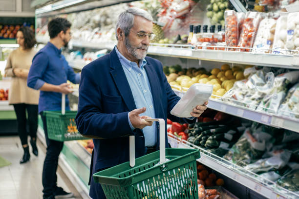 istock Mature man choosing vegetables in supermarket 1220514970