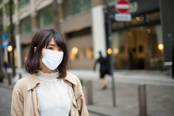 istock Young Japanese women,face guard mask 1220516496