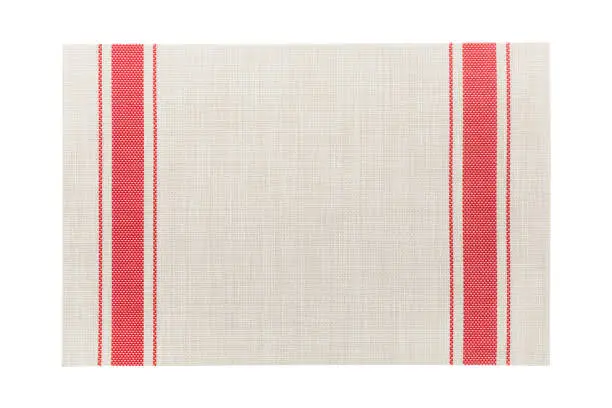 Photo of Top view of isolated red striped placemat for food. Empty space for your design