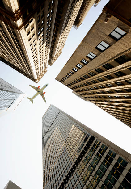 istock Airplane flying over skyscrapers, Lower Manhattan, NYC. 1220520510