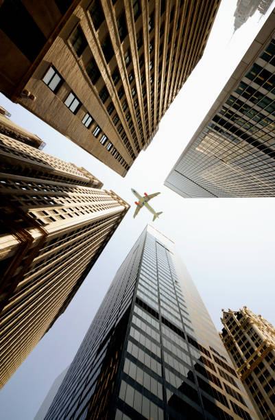 istock Airplane flying over skyscrapers, Lower Manhattan, NYC. 1220520544