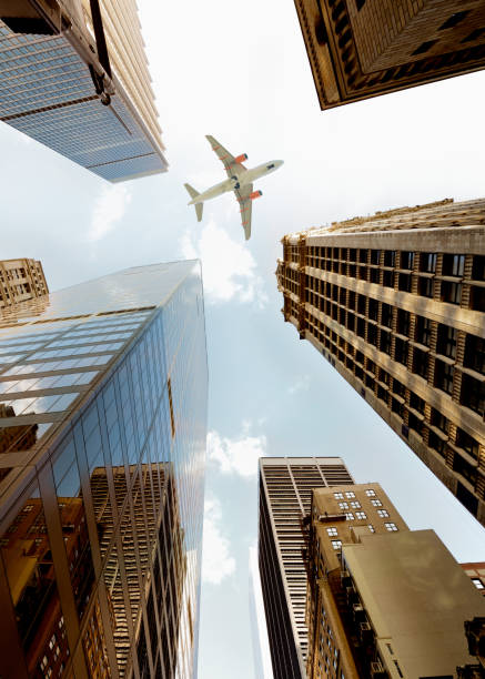 istock Airplane flying over skyscrapers, Lower Manhattan, NYC. 1220520799