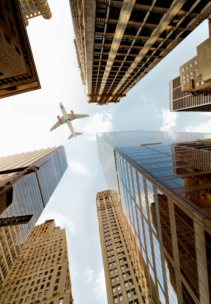 istock Airplane flying over skyscrapers, Lower Manhattan, NYC. 1220521142