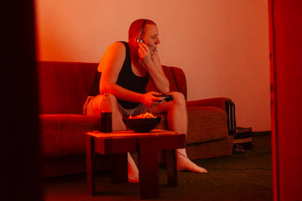 istock Gamer playing video games 1220521182