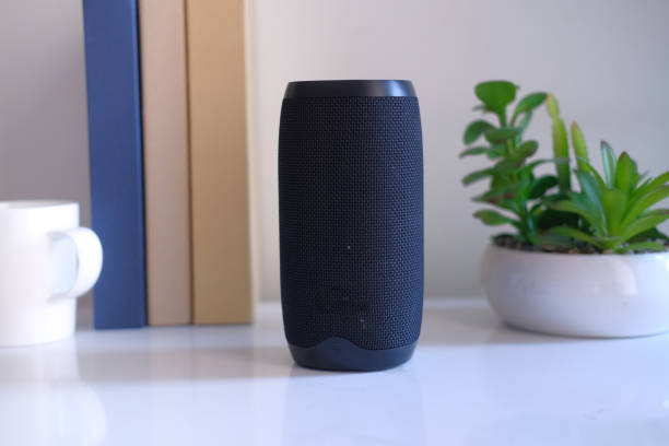 istock close up of smart speaker and digital tablet on table 1220523109