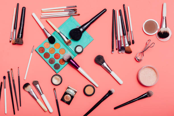 istock makeup artist for face makeup on a pink background 1220523153
