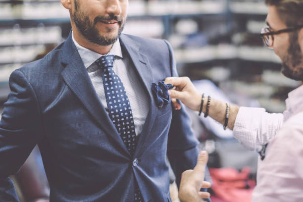 istock A personal stylist helping his customer 1220525977