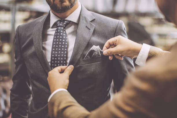 istock A personal stylist helping his customer 1220526007