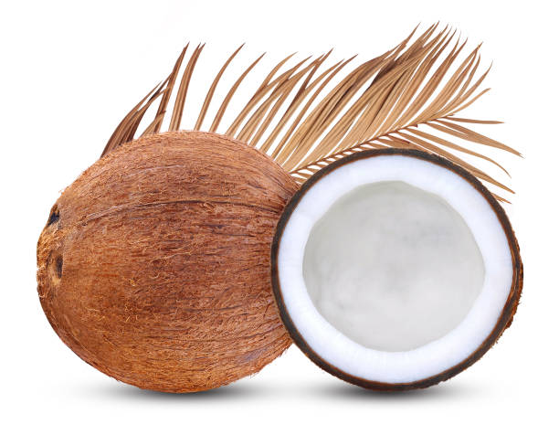 istock Fresh raw coconut with leaves isolated on white background. 1220528833