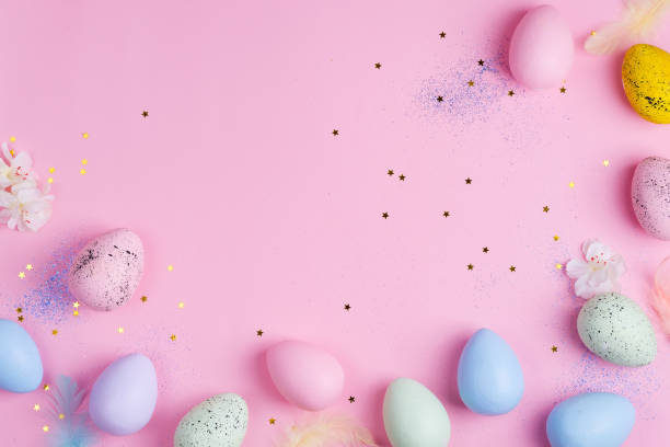 istock Beautiful Easter color pastel eggs on pink stars background with copy space 1220528835