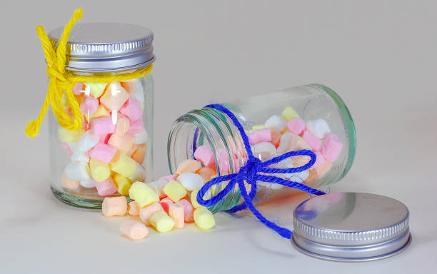 istock Marshmallow in the bottle glass isolated on white 1220528836