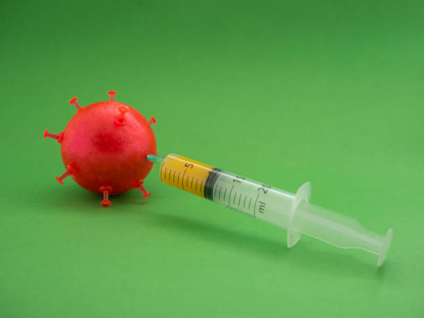 istock Syringe killing a coronavirus, covid-19. 1220529361