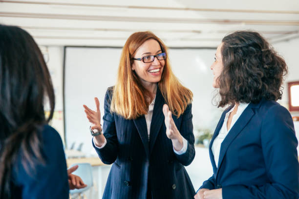 istock Cheerful female colleagues talking 1220530704