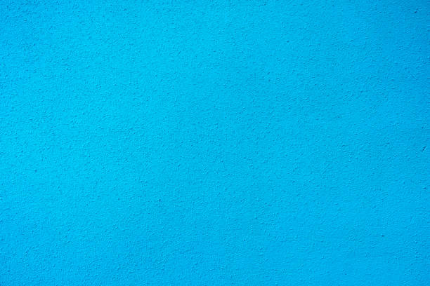 istock blue wall with a small fraction of plaster 1220531028