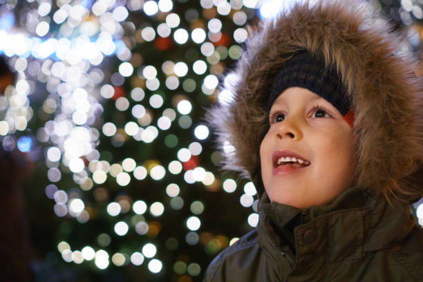 Christmas market A little boy enjoys the Christmas market environment in Prague. prague christmas market stock pictures, royalty-free photos & images