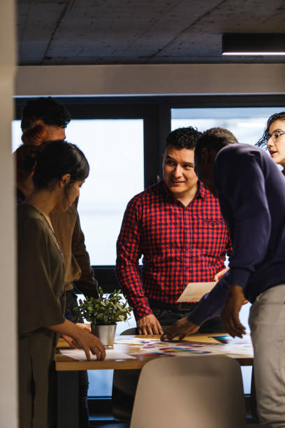istock Group of graphic designers selecting colors during a brainstorming session 1220534921