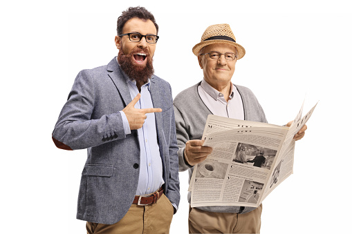 Bearded man laughing and pointing at an elderly man with a newspaper isolated on white background