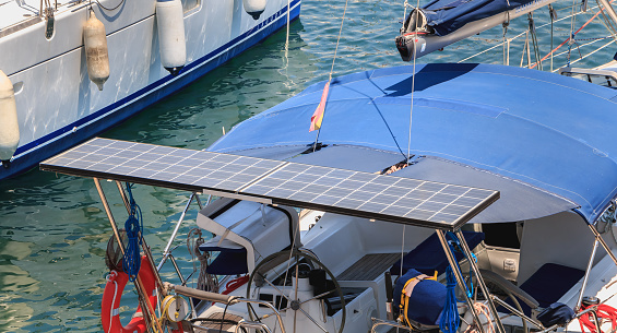 Barcelona, Spain - June 21, 2017: photovoltaic panel on a sailboat in the city harbor on a summer day