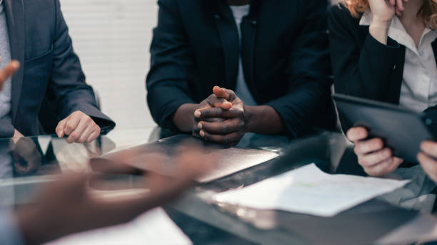 istock close up. multi-ethnic business team discussing new ideas 1220536742