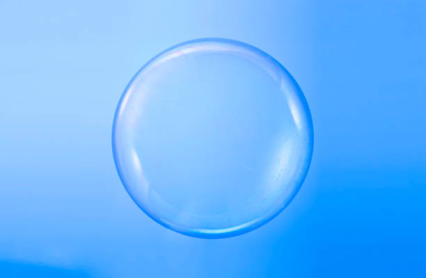 istock Soap bubble ball water drop foam bubbles. Isolated on blue background 1220537042
