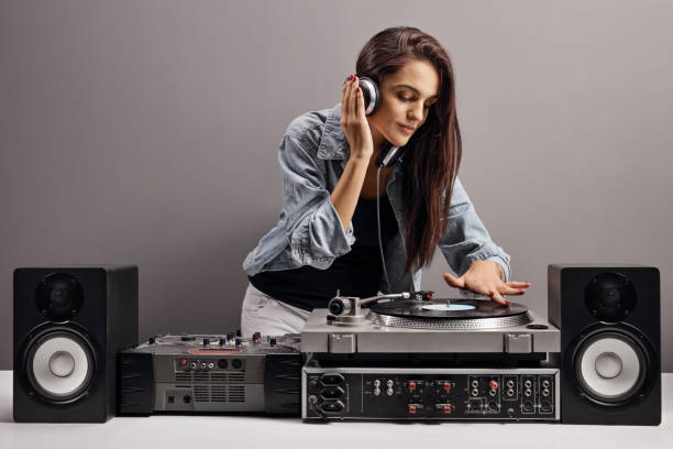 istock Young woman dj playing music 1220539450